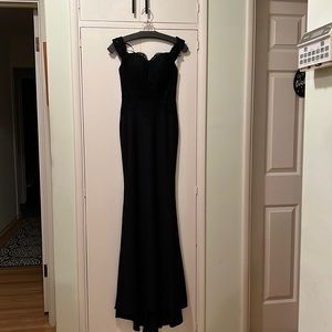 Formal black long dress. Polyester. Hand wash cold. Size xs